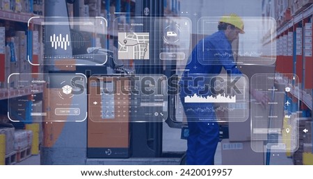 Image of data on screens over caucasian man in warehouse. Global networks, business, finances, computing and data processing concept digitally generated image.