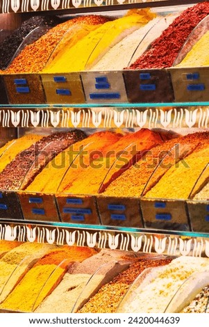 Spices Market with colourful mood. Multicolor spices sold at Egypt Bazaar (Misir Carsisi) in Istanbul, Turkey (Turkiye). Selected focus, vertical, copy space. Colorful food background
