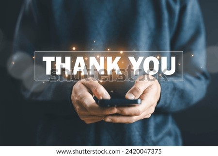 businessman using a smartphone and showing the message thank you on a display screen. concept of thank you business, congratulations, presentation from technology digital, appreciation, and gratitude 