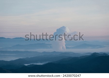 Beautiful morning scenery with fog in the background at Mae Moh Lignite Coal Power Plant, Lampang, Thailand Industrial white vapor from cooling and tower pipes, industrial and environmental themes