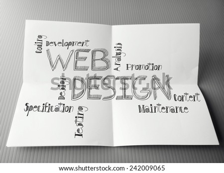 hand drawn web design diagram on crumpled paper background as concept 