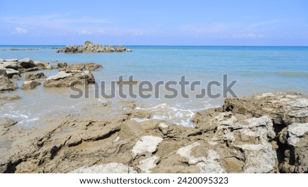The Natural View Of The Tropical Sea Of Tanjung Kalian With Stretches Of Coral Rocks During The Day