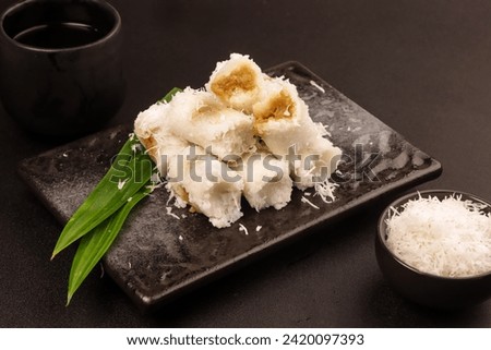 Putu Bumbung or Kue Putu Bambu is a Cake made from Rice Flour and Formed Using Bamboo Molds Filled with Palm Sugar.