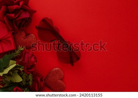 Valentine's Day decorations concept. Top view photo of gift boxes with rose and heart on isolated pastel red background with copyspace