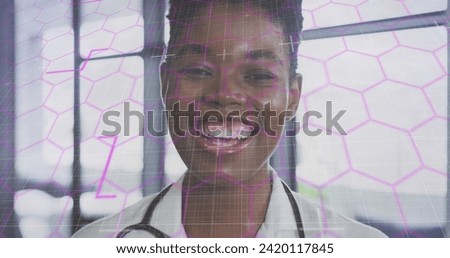 Image of data processing over african american female doctor. Global medicine, computing and data processing concept digitally generated image.