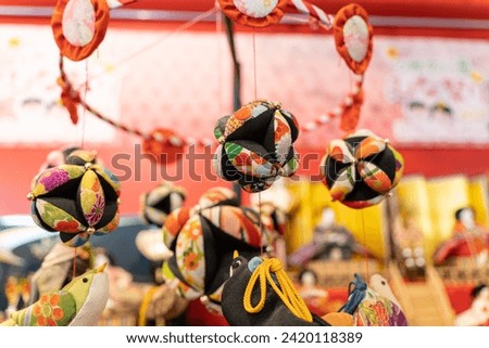 The image beautifully showcases the intricate craftsmanship and cultural richness of these ornate dolls, carefully arranged in a display that embodies the spirit of the doll festival. 