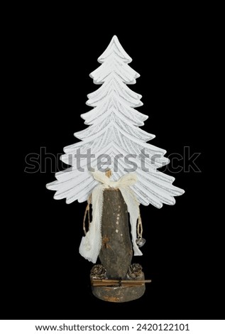 Handmade wooden christmas tree, isolated on black bacground