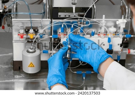 Technician preparing chemical radioactive contrast agent medicine for radiology and nuclear medicine and molecular imaging	 Royalty-Free Stock Photo #2420137503