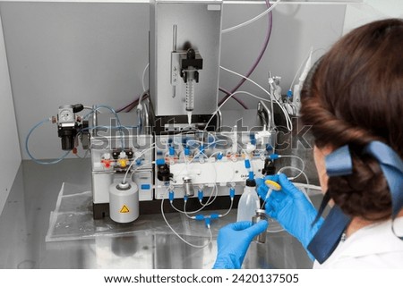 Technician preparing chemical radioactive contrast agent medicine for radiology and nuclear medicine and molecular imaging	 Royalty-Free Stock Photo #2420137505