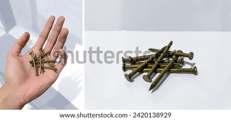 bronze steel nail grabbed by man hand