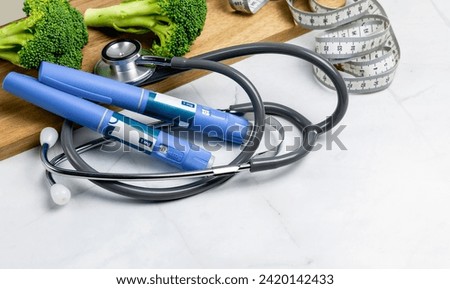 Ozempic Insulin injection pen or insulin cartridge pen for diabetics. Medical equipment for diabetes parients.  Royalty-Free Stock Photo #2420142433