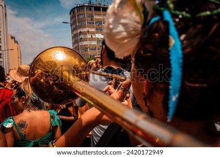 Rio de Janeiro, RJ, Brazil. February, 07, 2016. A musician playing trombone in a street parade at carnival of Rio de Janeiro.