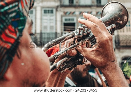 Rio de Janeiro, RJ, Brazil. February, 07, 2016. A musician playing trumpet in a street parade at carnival of Rio de Janeiro.