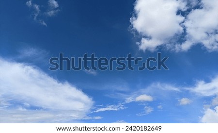 blue sky background decorated with white clouds