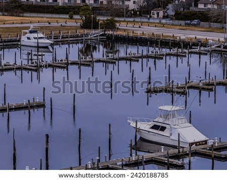 An aerial view of a mostly empty marina in the off season, on a cloudy day on Long Island, New York. Royalty-Free Stock Photo #2420188785