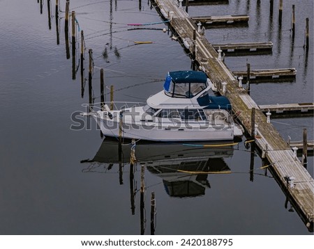 An aerial view of a mostly empty marina in the off season, on a cloudy day on Long Island, New York. Royalty-Free Stock Photo #2420188795