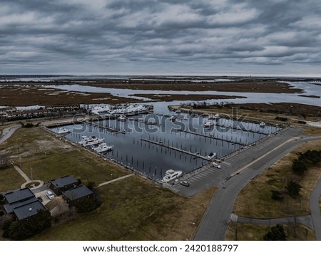 An aerial view of a mostly empty marina in the off season, on a cloudy day on Long Island, New York. Royalty-Free Stock Photo #2420188797