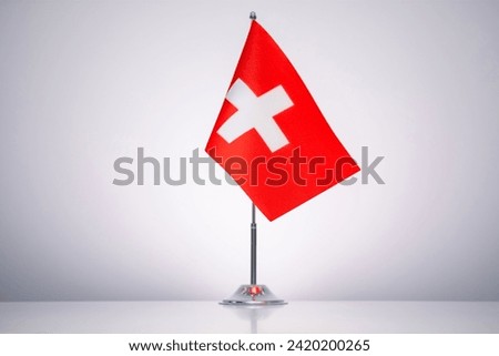 Switzerland flag with a gray and clean background.