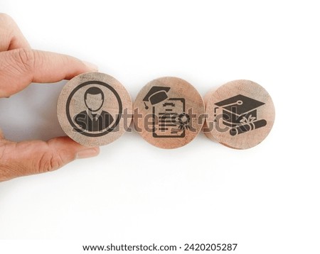 Hand holding a Wooden blocks with qualifications, certificates and graduate icons. The concept of academic qualifications. The concept of required skills.

 Royalty-Free Stock Photo #2420205287
