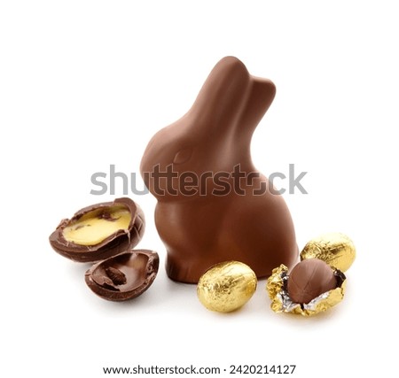 Chocolate Easter eggs and bunny isolated on white background Royalty-Free Stock Photo #2420214127