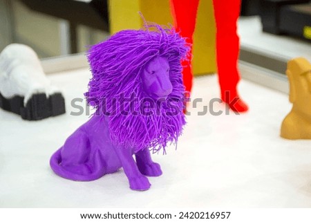 Art object model of lion printed on 3D printer. Lion toy created by 3D printing from molten plastic. Example of creating prototype by 3D printer. Concept 3D printing. Printing innovation technology