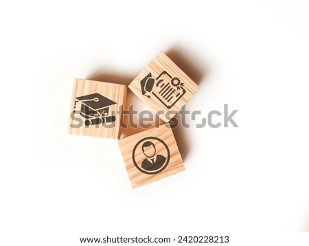 Wooden blocks with qualifications, certificates and graduate icons. The concept of academic qualifications. The concept of required skills. Royalty-Free Stock Photo #2420228213