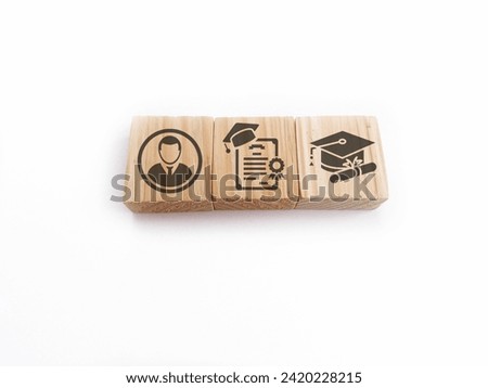Wooden blocks with qualifications, certificates and graduate icons. The concept of academic qualifications. The concept of required skills. Royalty-Free Stock Photo #2420228215