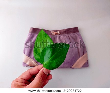Women's panties and betel leaves. Using boiled water from betel leaves can help maintain the pH balance of the feminine area, is antibacterial and prevents vaginal discharge.
Female health concept.