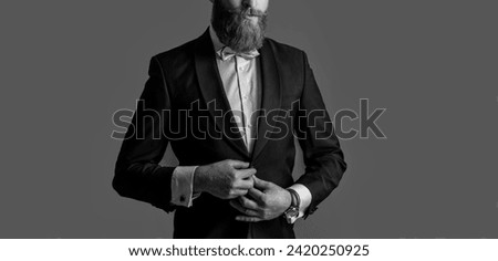cropped view of bearded man in tux isolated on grey background. man studio shot in tux Royalty-Free Stock Photo #2420250925