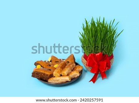 The vernal equinox, a traditional table on Navruz. wheat grass, Arabic baklava dessert, sweets, nuts, dried fruits.