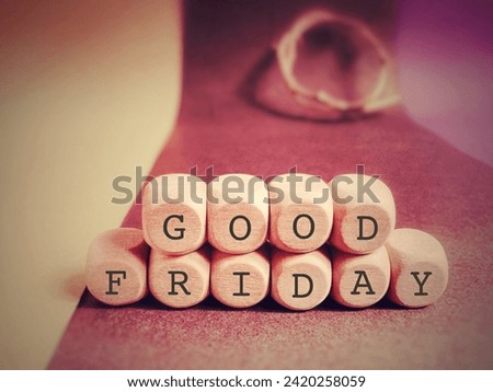 Holy Week, Lent, Good Friday Concept - Good Friday text on wooden cubes with red colour background. Stock photo.