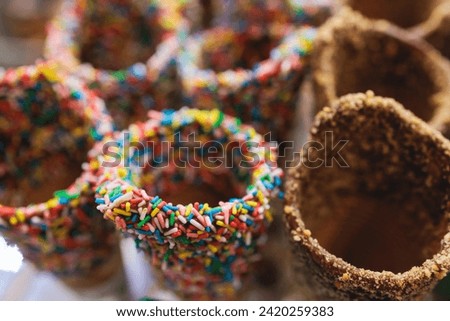 Trdelnik, traditional czech and european sweet street food trdlo, process of baking and cooking on street food festival market kiosk, Food festival with stall kiosk, open-air outdoor  Royalty-Free Stock Photo #2420259383