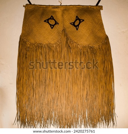 Photo of a ritualistic skirt, made of straw, typical of the indigenous people of the Brazilian Amazon