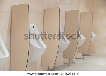 Men's public toilet in a shopping mall.