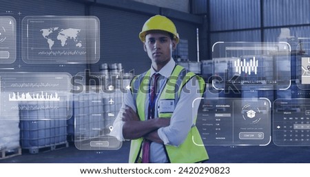 Image of data processing on screens over biracial man working in warehouse. Global shipping, networks, computing and data processing concept digitally generated image.
