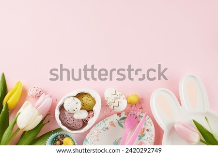 Joyful Easter surprises: delighting kids with egg-citement. Top view photo of cute plates, eggs, cutlery, tulips, sprinkles on pastel pink background with space for festive message