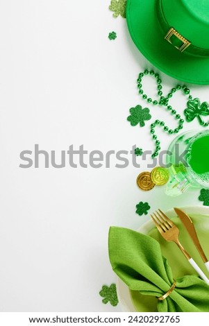 Leprechaun's glee: Perfecting your St. Patrick's Day feast. Top view vertical shot of plates, cutlery, leprechaun hat, green beer, trefoils, coins, beads on white background with space for greetings