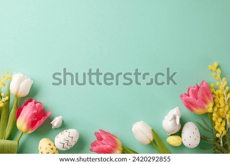 Easter in bloom: celebrating renewal and rebirth in spring. Top view photo of eggs, bunnies, fresh tulips, mimosa on turquoise background with space for festive message