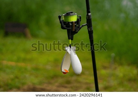 Sport fishing gear - reel and feeder on the rod when fishing...