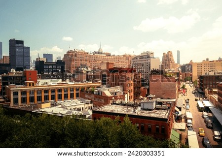 Manhattan, New York City, Meat Packing District overlooking Greenwich and west village in bright, warm and cinematic daylight. Skyscrapers and traditional American red brick buildings. No logos