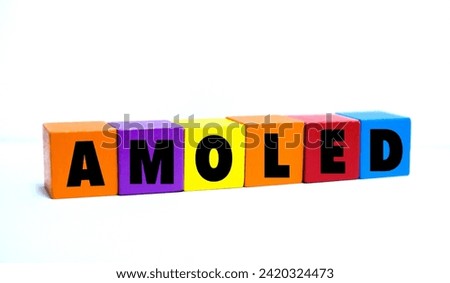 A coloured wooden block with word “AMOLED”. AMOLED stands for “Active Matrix Organic Light Emitting Diode”