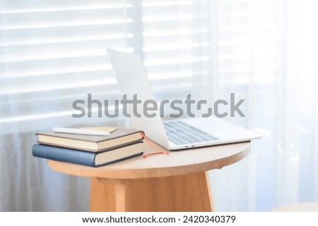 Laptop and books on the table