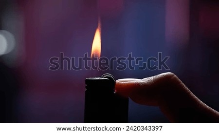 lighter with your thumb pressed
