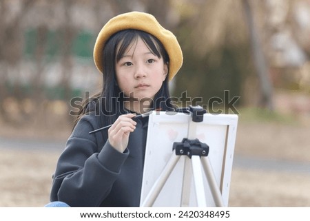 Girl drawing a picture image
