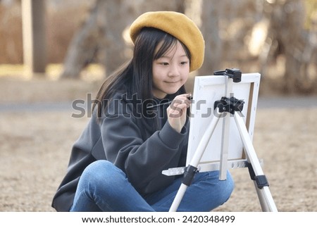 Girl drawing a picture image
