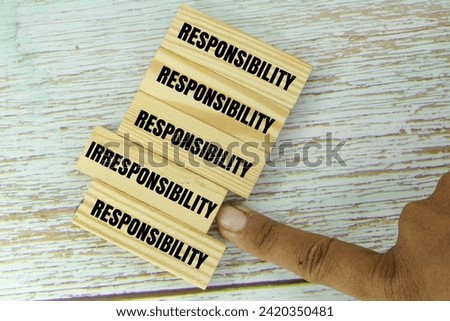 wooden arrangement with the words responsibility and irresponsibility. the concept of one's responsibility Royalty-Free Stock Photo #2420350481
