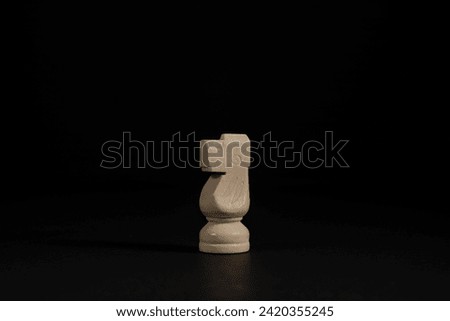 Isolated image of white knight chess piece on black background.