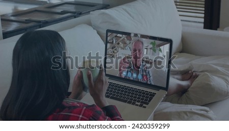Woman on image call with laptop. Digital interface global connection and communication concept digitally generated image.