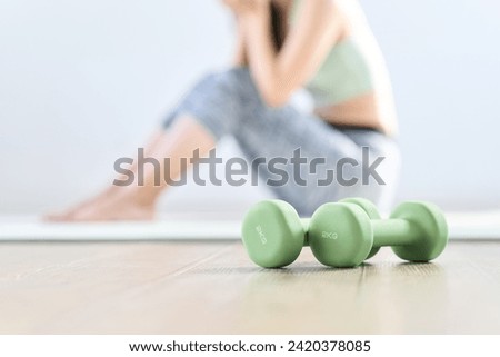A woman feels depressed because her home training doesn't go well Royalty-Free Stock Photo #2420378085