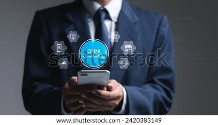 Omni Channel concept. Businessman use mobile smartphone with virtual omni channel icons for business and social media marketing. Royalty-Free Stock Photo #2420383149